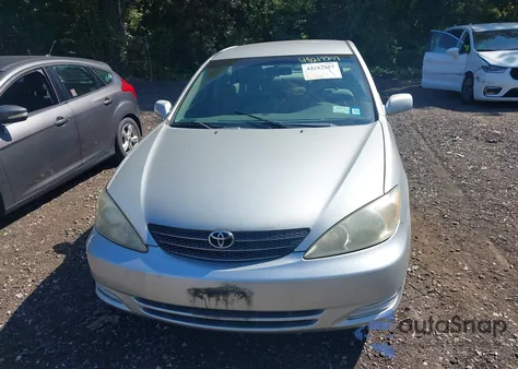 2003 Toyota Camry Le z USA, uszkodzony, nr VIN 4T1BE32K13U123714